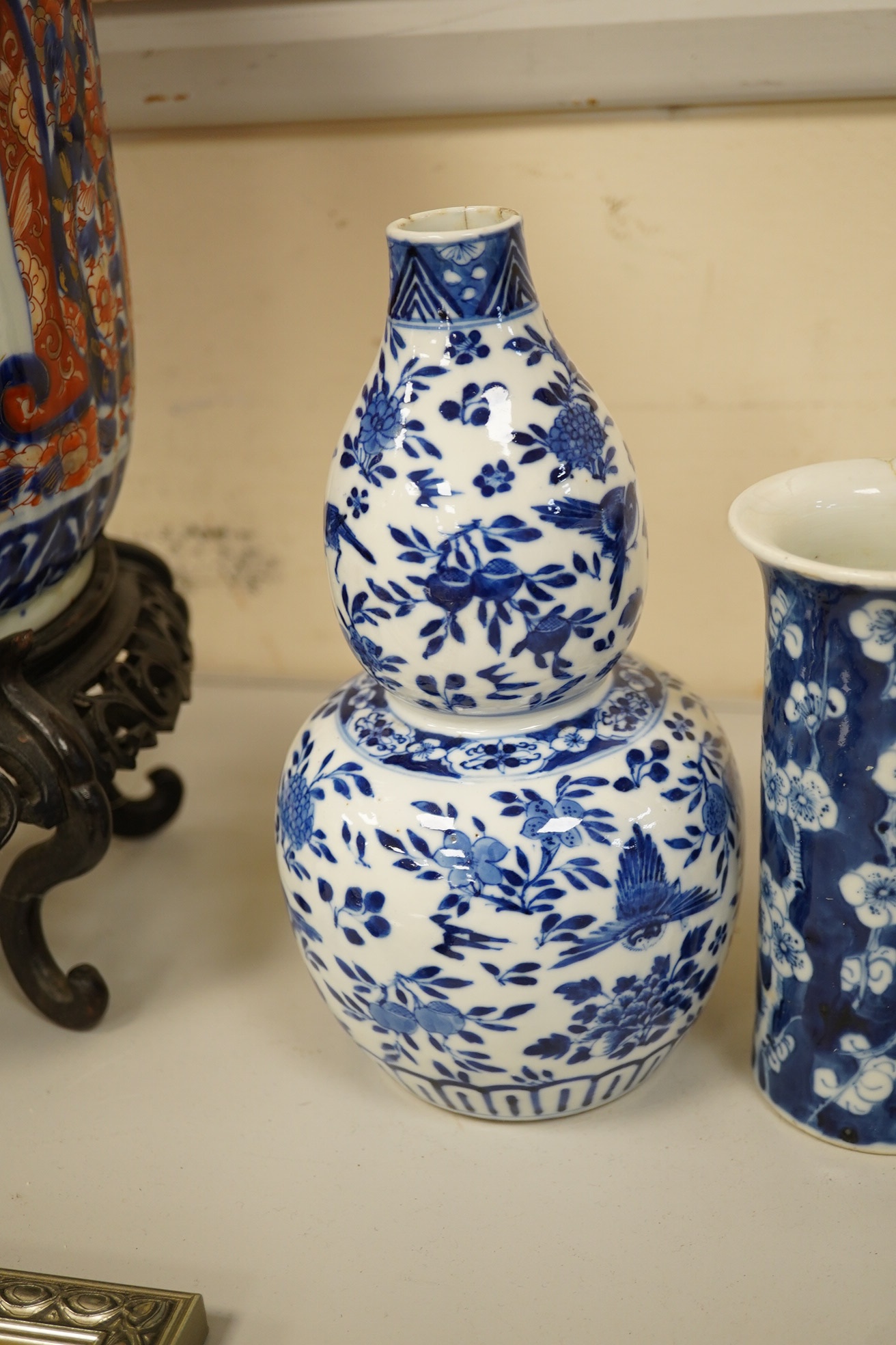 Four 19th century Chinese blue and white jars / vases, including a moon flask and double gourd vase, largest 23cm high. Condition - poor